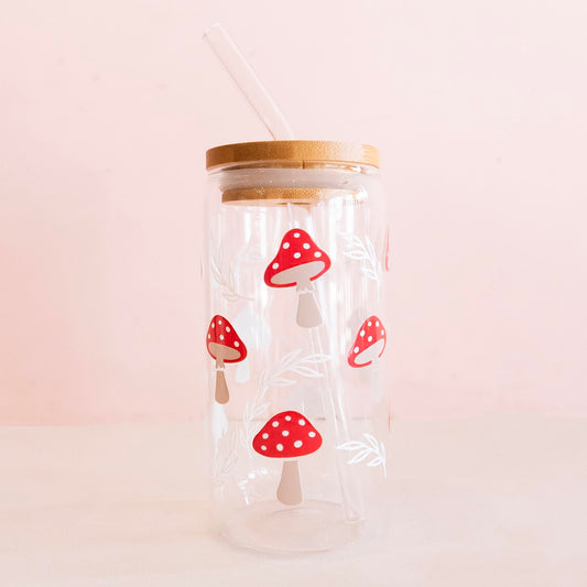 Eco-friendly glass tumbler featuring a whimsical mushroom design, complete with a bamboo lid and reusable glass straw, perfect for stylish and sustainable hydration.